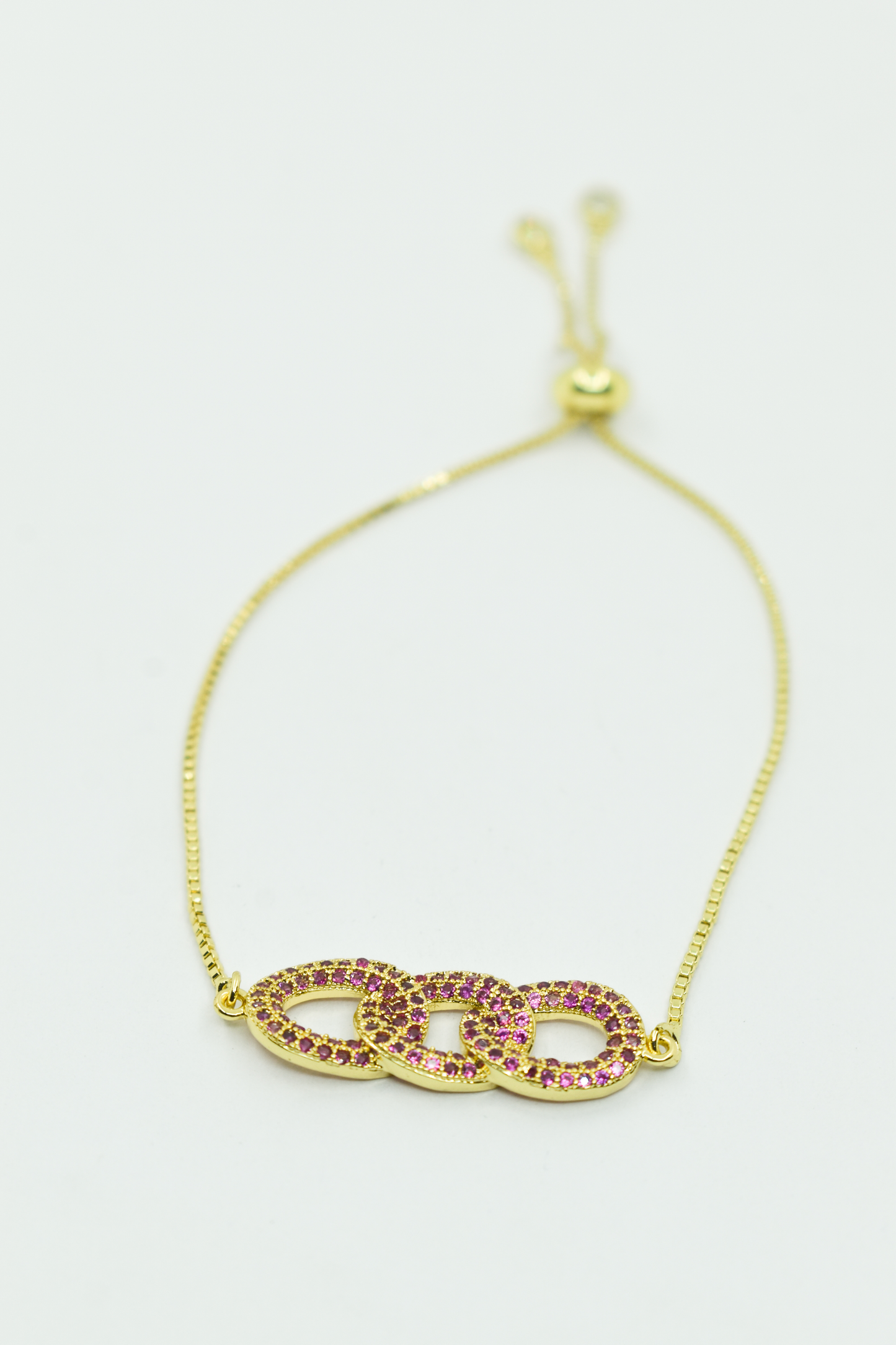 MANILLA DORADA CIRCULOS ROSADOS